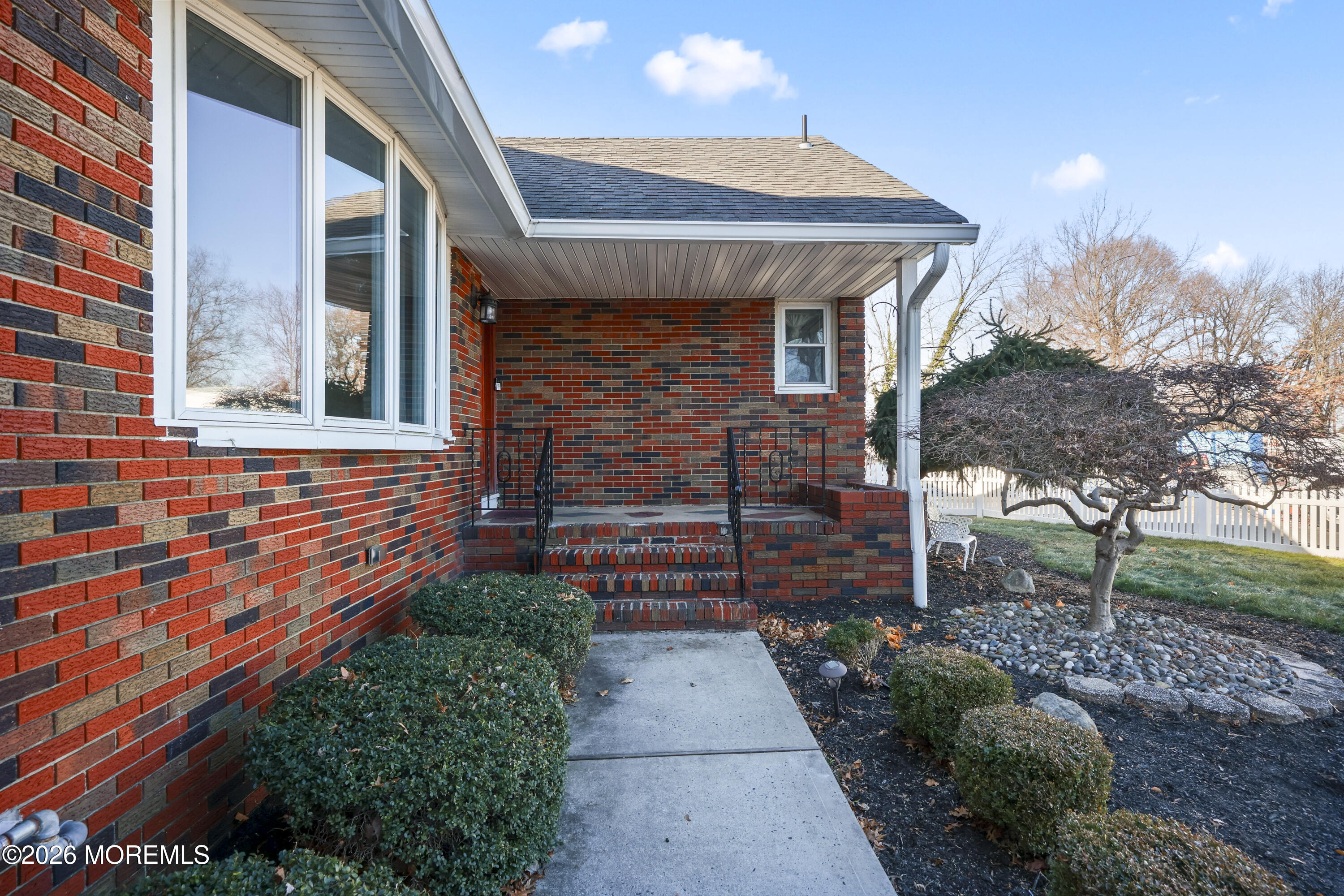 573 Lloyd Road Aberdeen, NJ 07747 - Photo 3 of 23 a front view of a house with garden