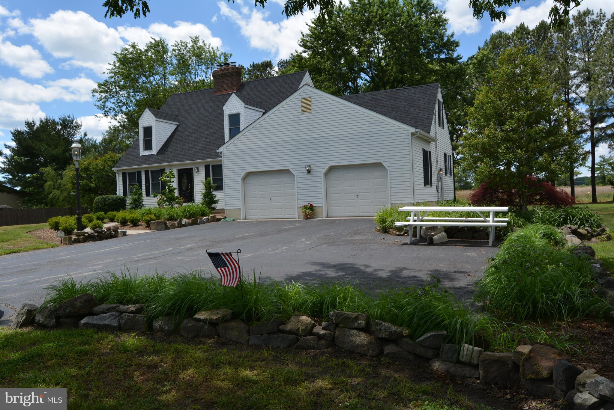 469 Red Lion Road Southampton, NJ 08088 - Photo 2 of 45 a front view of a house with a yard and garage