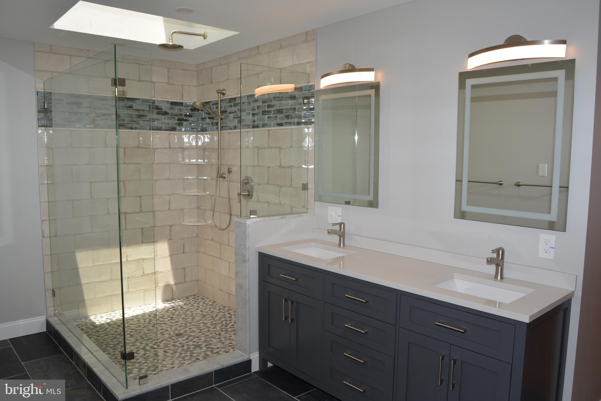 469 Red Lion Road Southampton, NJ 08088 - Photo 19 of 45 a bathroom with a shower sink and mirror