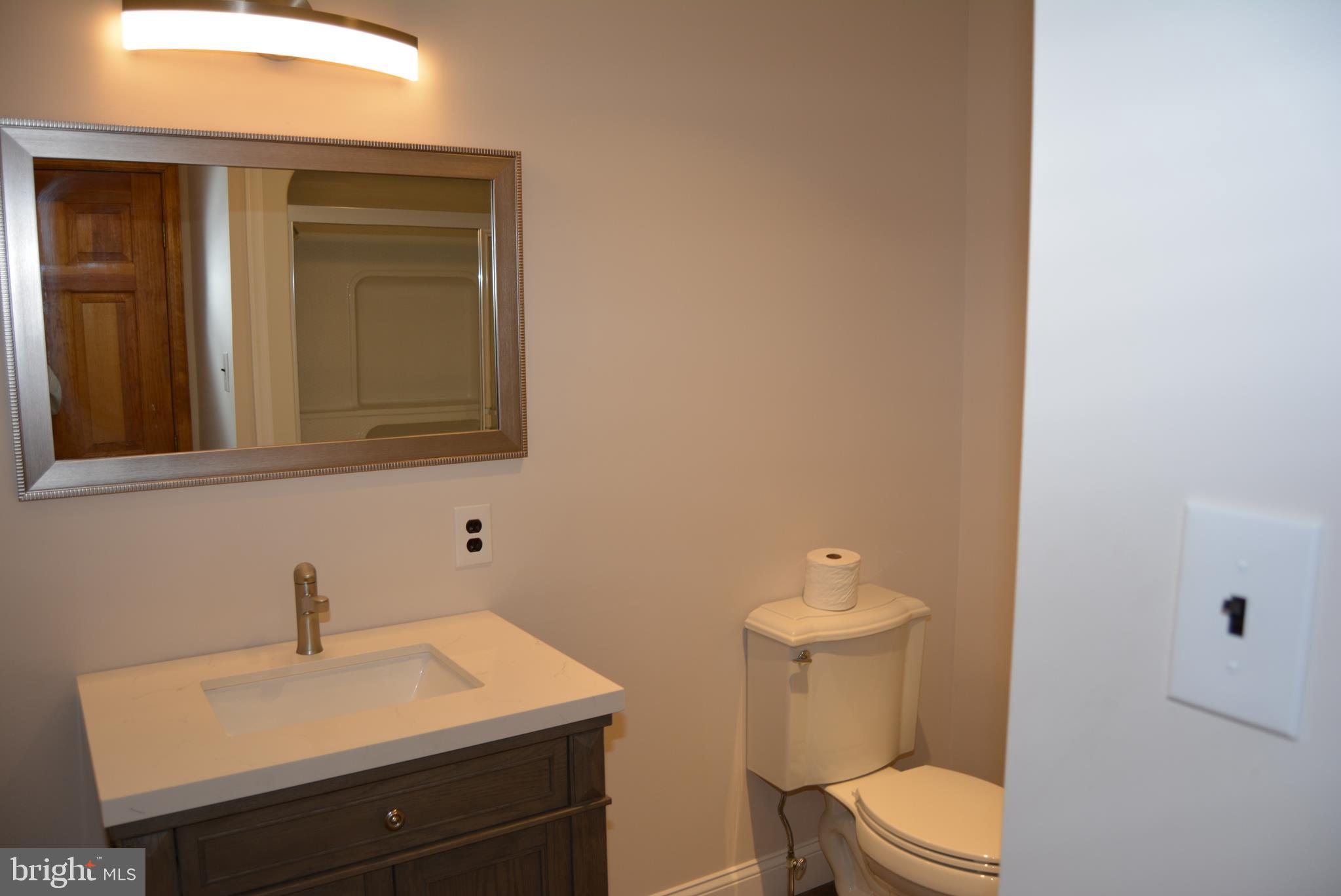 469 Red Lion Road Southampton, NJ 08088 - Photo 25 of 45 a bathroom with a toilet a sink and mirror