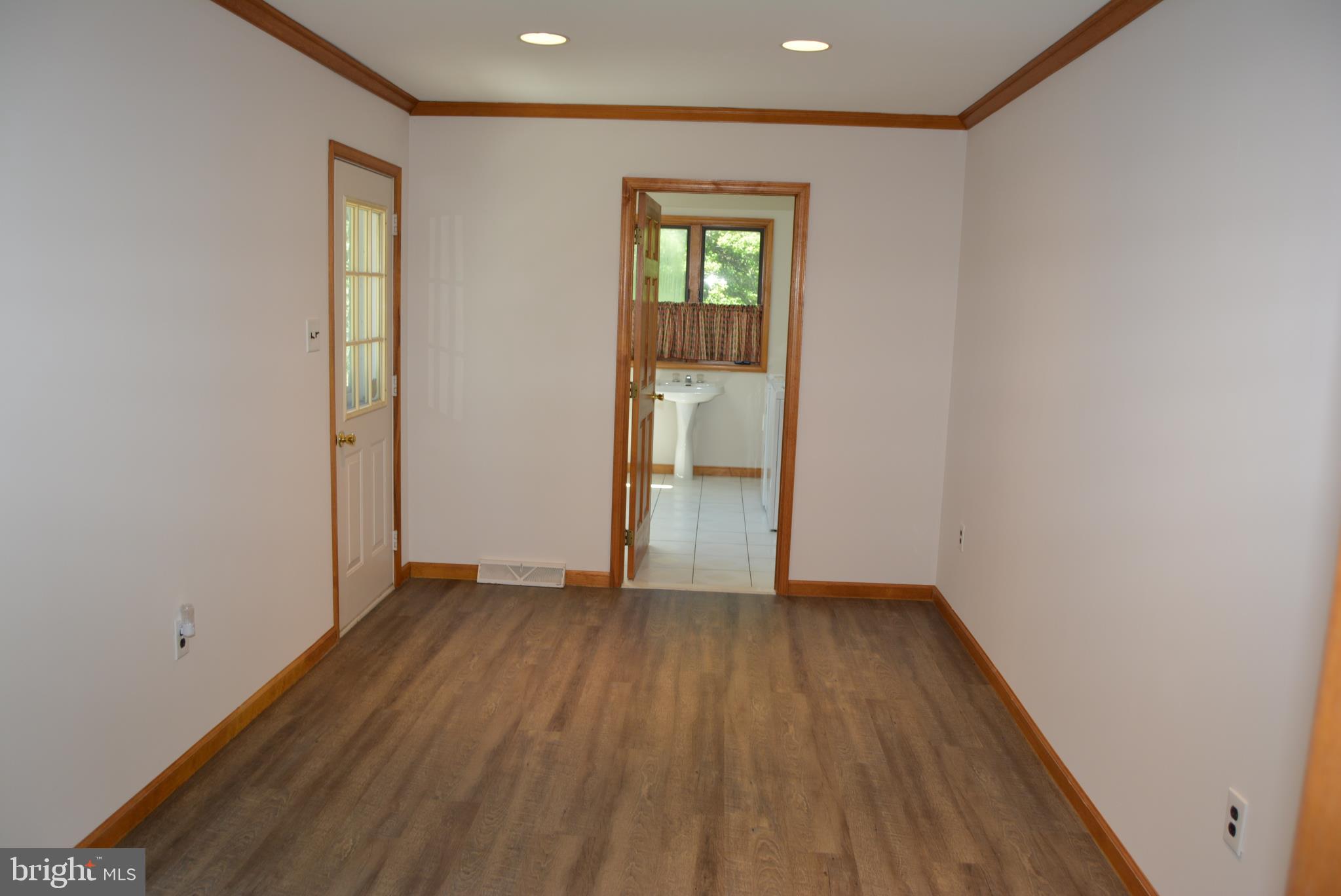 469 Red Lion Road Southampton, NJ 08088 - Photo 27 of 45 an empty room with wooden floor and windows