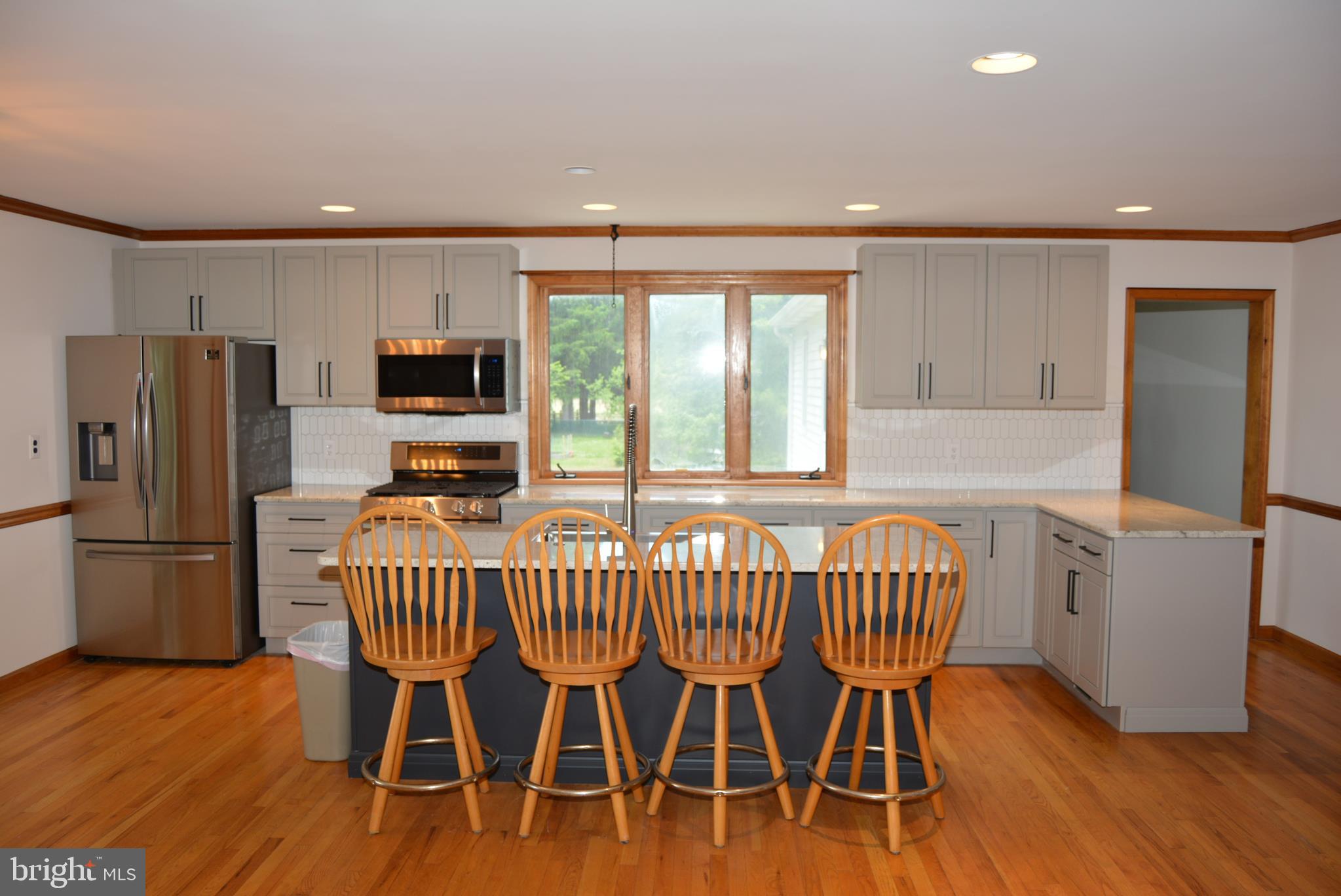 469 Red Lion Road Southampton, NJ 08088 - Photo 6 of 45 a kitchen with stainless steel appliances granite countertop a dining table chairs refrigerator and sink