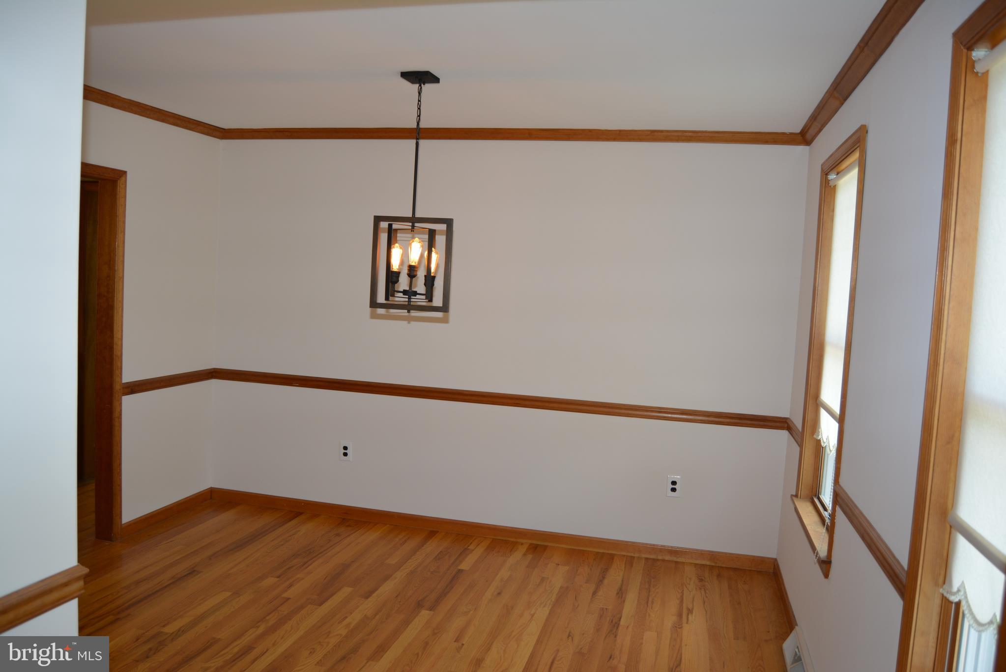 469 Red Lion Road Southampton, NJ 08088 - Photo 10 of 45 a view of an empty room with wooden floor and a window