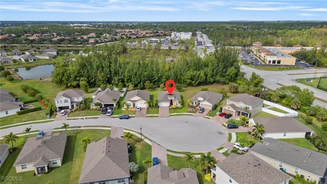 an aerial view of a house with outdoor space and lake view