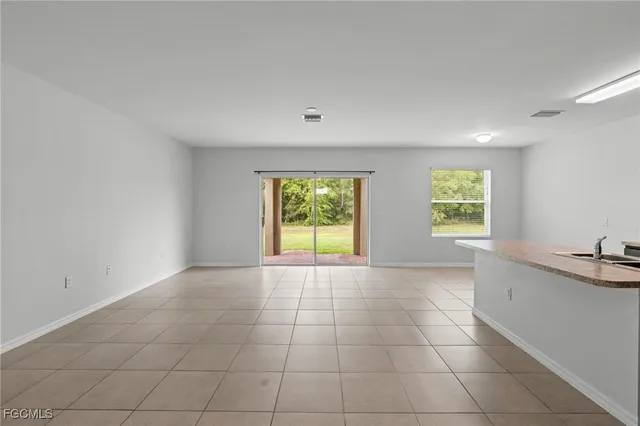 a view of an empty room and window