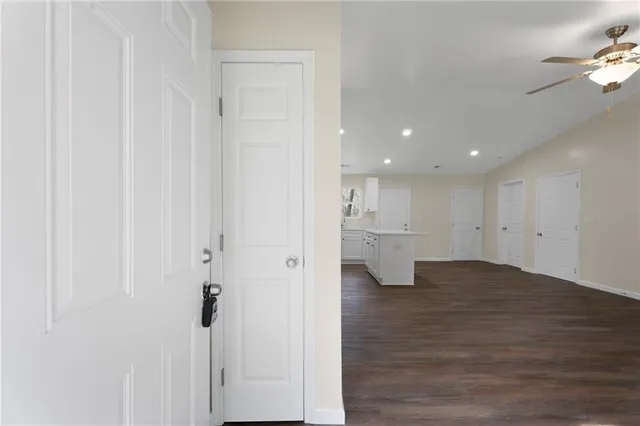 a view of a kitchen with wooden floor