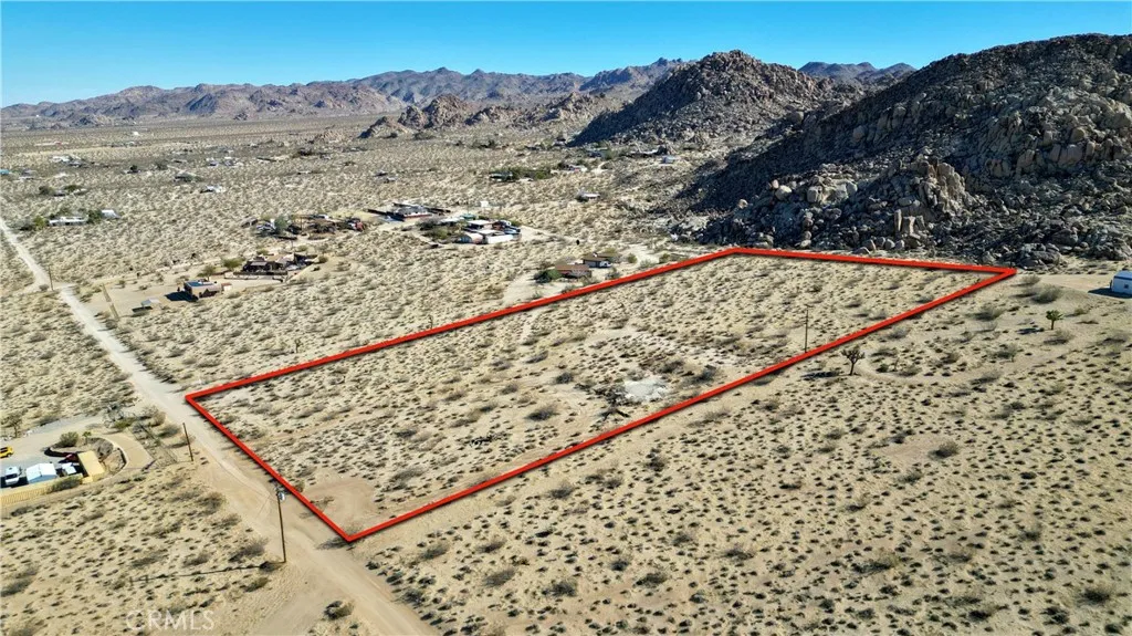 1040 Sullivan Road Santa Ana, CA 92704 - Photo 13 of 24 a view of a dry yard with wooden fence