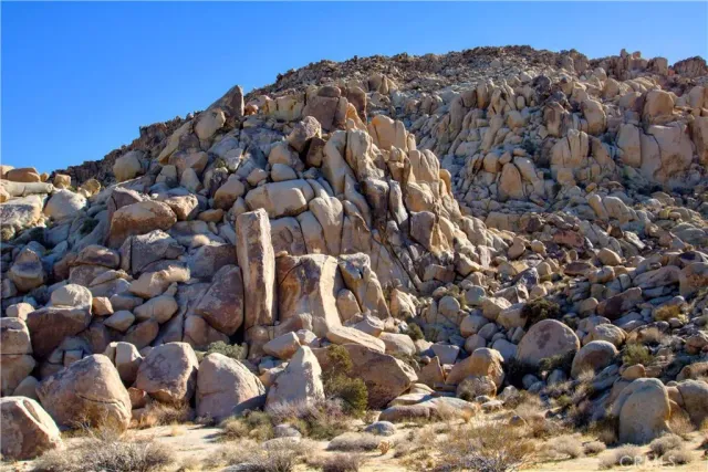 a view of a large building with a mountain