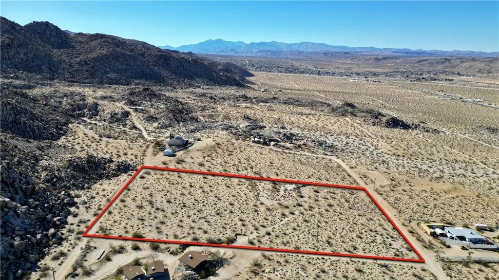 1040 Sullivan Road Santa Ana, CA 92704 - Photo 9 of 24 a view of a dry parking area with a mountain