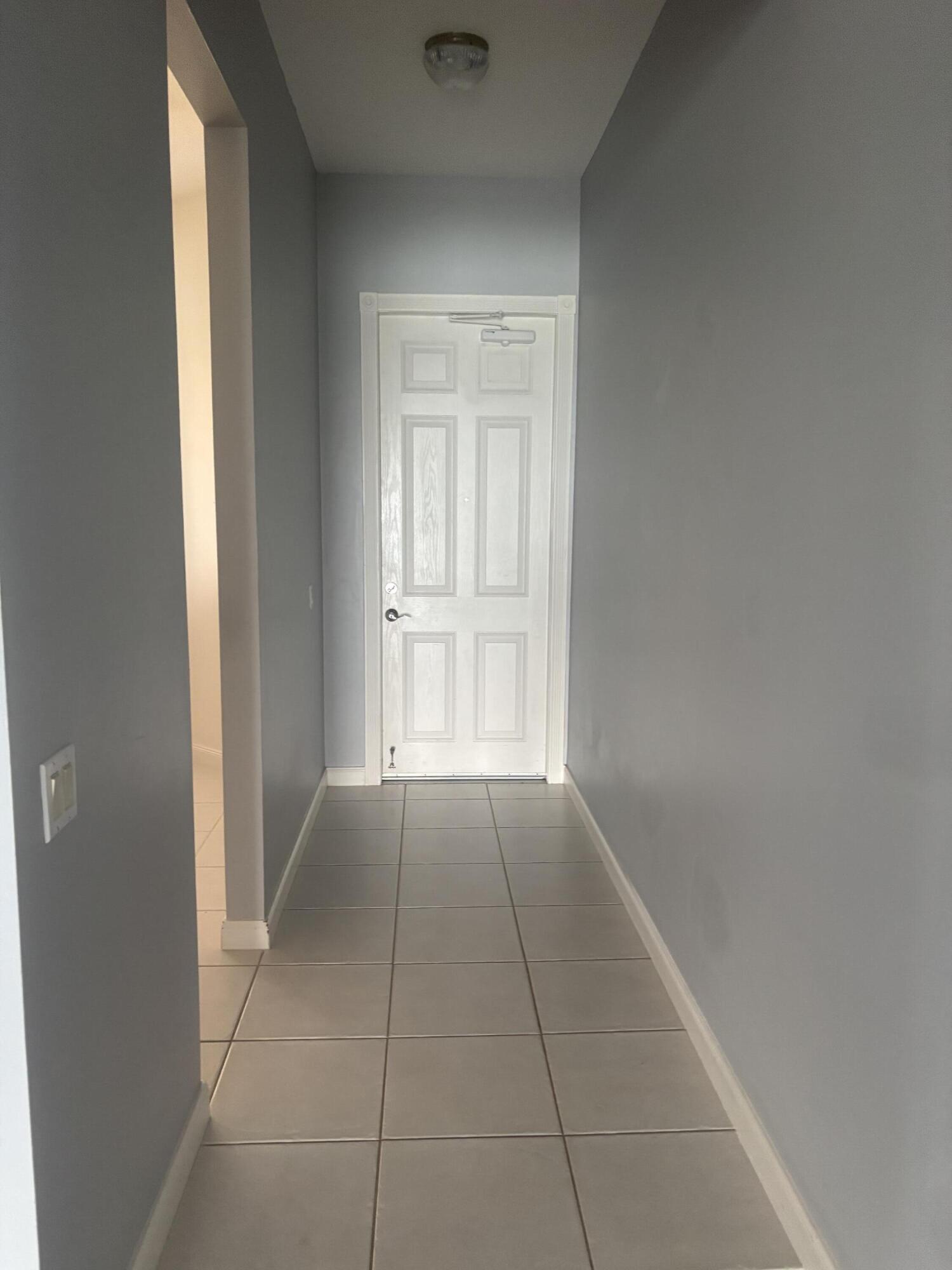 31 Harbour Isle Drive West, Unit 303 Fort Pierce, FL 34949 - Photo 2 of 31 a view of an empty room and window