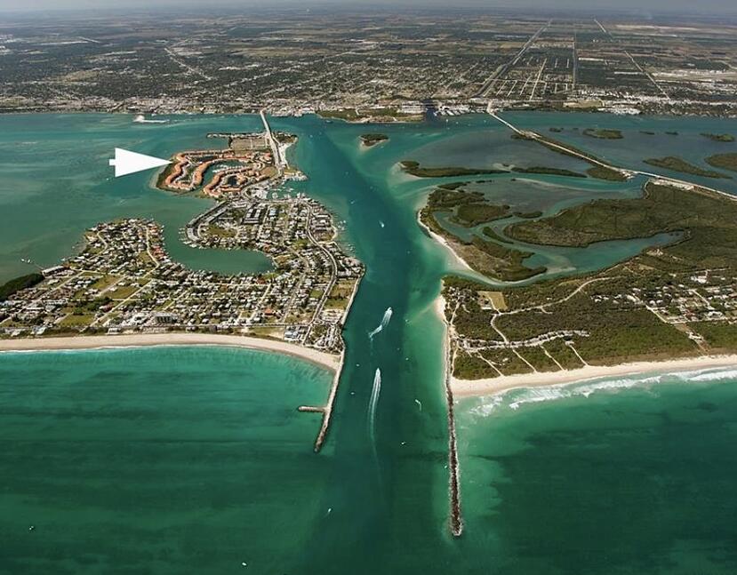 31 Harbour Isle Drive West, Unit 303 Fort Pierce, FL 34949 - Photo 21 of 31 an aerial view of a residential houses with outdoor space and trees