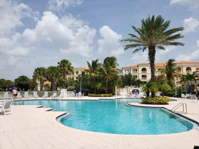 a view of a swimming pool with a yard