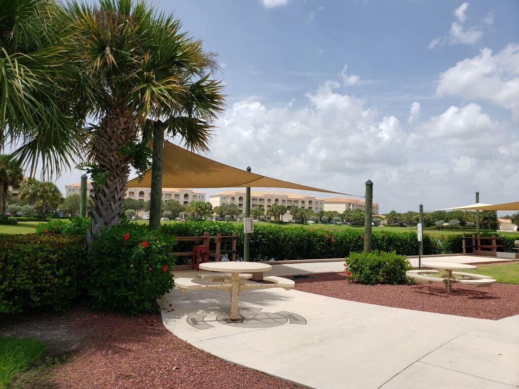 31 Harbour Isle Drive West, Unit 303 Fort Pierce, FL 34949 - Photo 25 of 31 a view of a fountain in front of a house