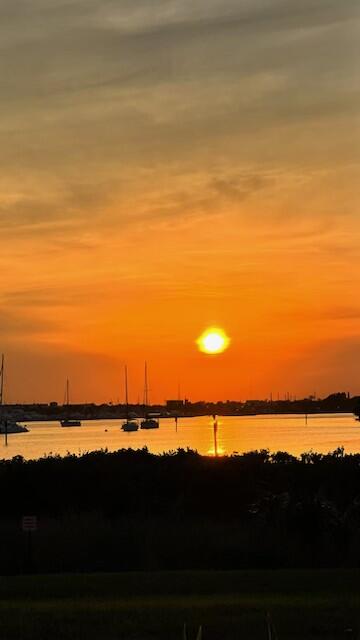 31 Harbour Isle Drive West, Unit 303 Fort Pierce, FL 34949 - Photo 30 of 31 a view of ocean and sunset