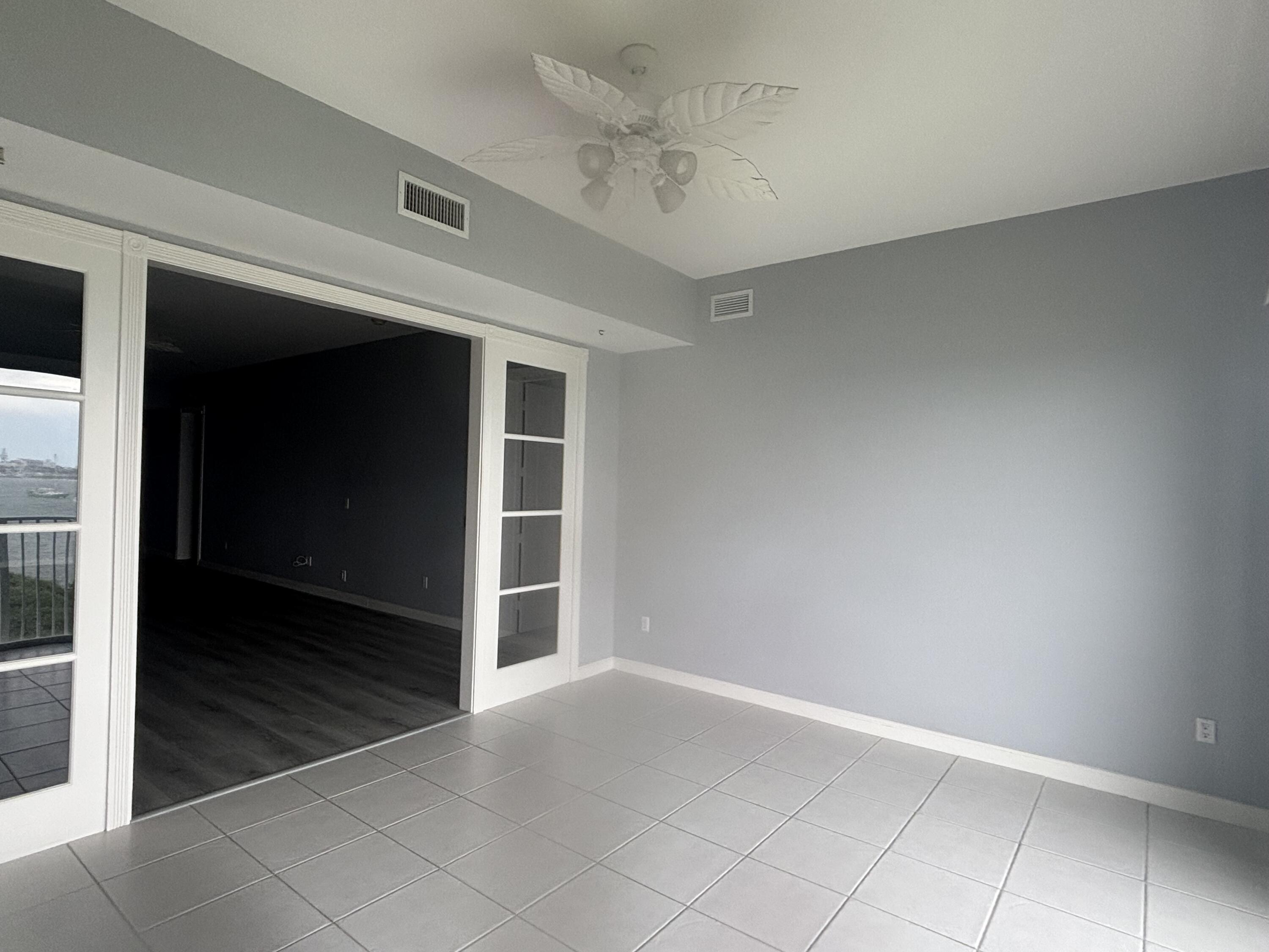 31 Harbour Isle Drive West, Unit 303 Fort Pierce, FL 34949 - Photo 10 of 31 an empty room with windows