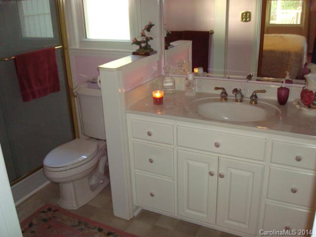 3205 Puetts Chapel Road Dallas, NC 28034 - Photo 11 of 24 a bathroom with a toilet sink and mirror