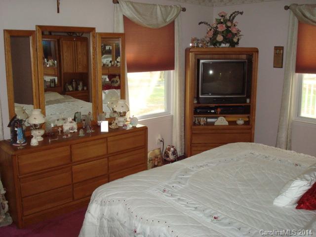 3205 Puetts Chapel Road Dallas, NC 28034 - Photo 13 of 24 a bedroom with a bed and a dresser