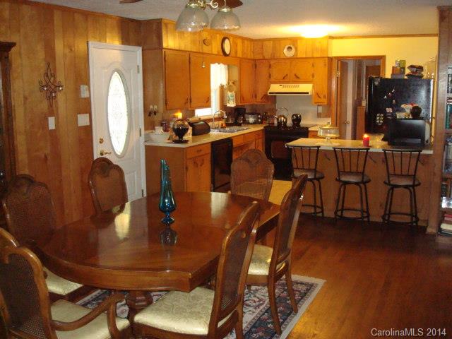 3205 Puetts Chapel Road Dallas, NC 28034 - Photo 18 of 24 a dining room with furniture a chandelier and wooden floor