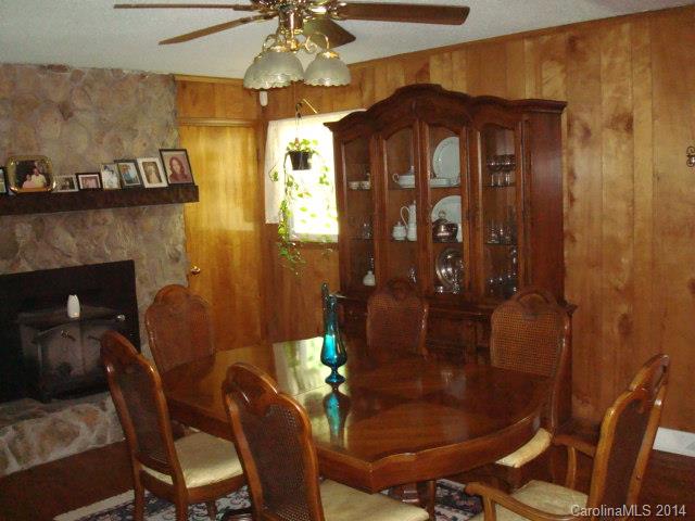 3205 Puetts Chapel Road Dallas, NC 28034 - Photo 19 of 24 a view of a dining room with furniture and chandelier