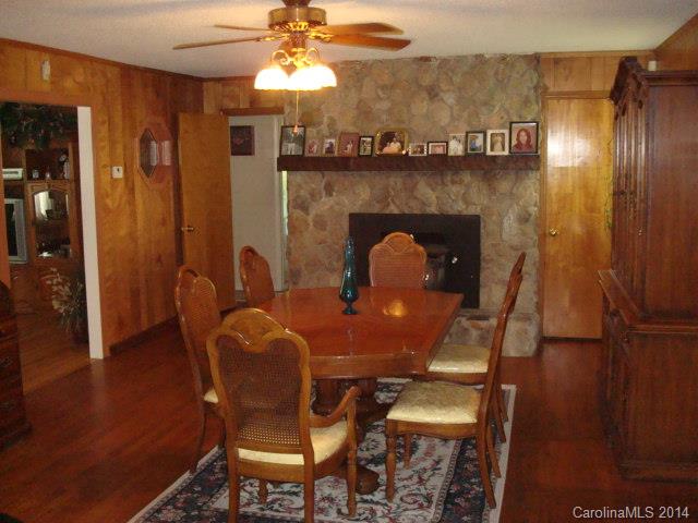 3205 Puetts Chapel Road Dallas, NC 28034 - Photo 3 of 24 a dining room with furniture and chandelier