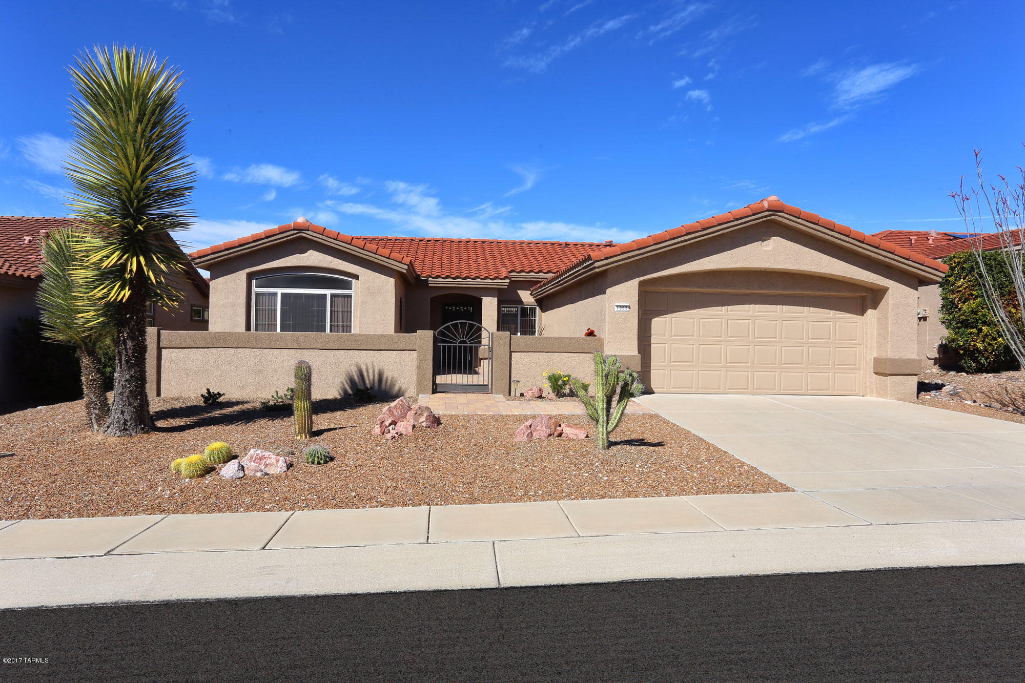 a front view of a house with garage