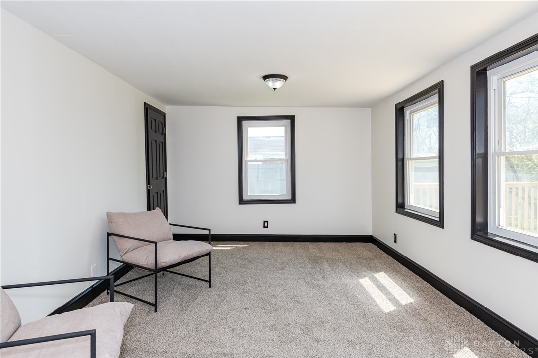 5240 Haverfield Road Dayton, OH 45432 - Photo 23 of 58 This bright room features abundant natural light and soft carpeting, perfect for relaxation.