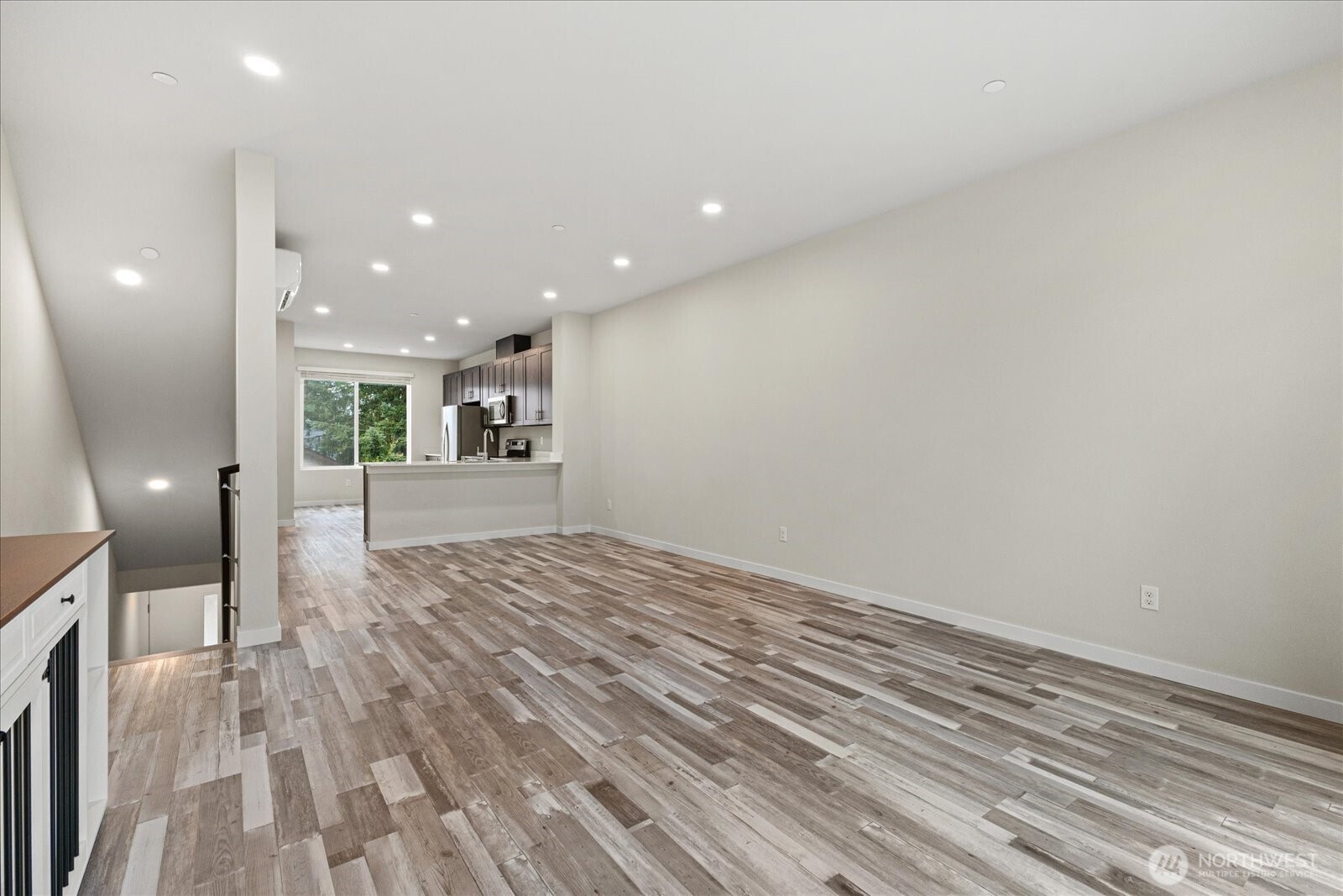 1831 100th Street Southwest, Unit B Everett, WA 98204 - Photo 11 of 27 a view of a big room with wooden floor and windows