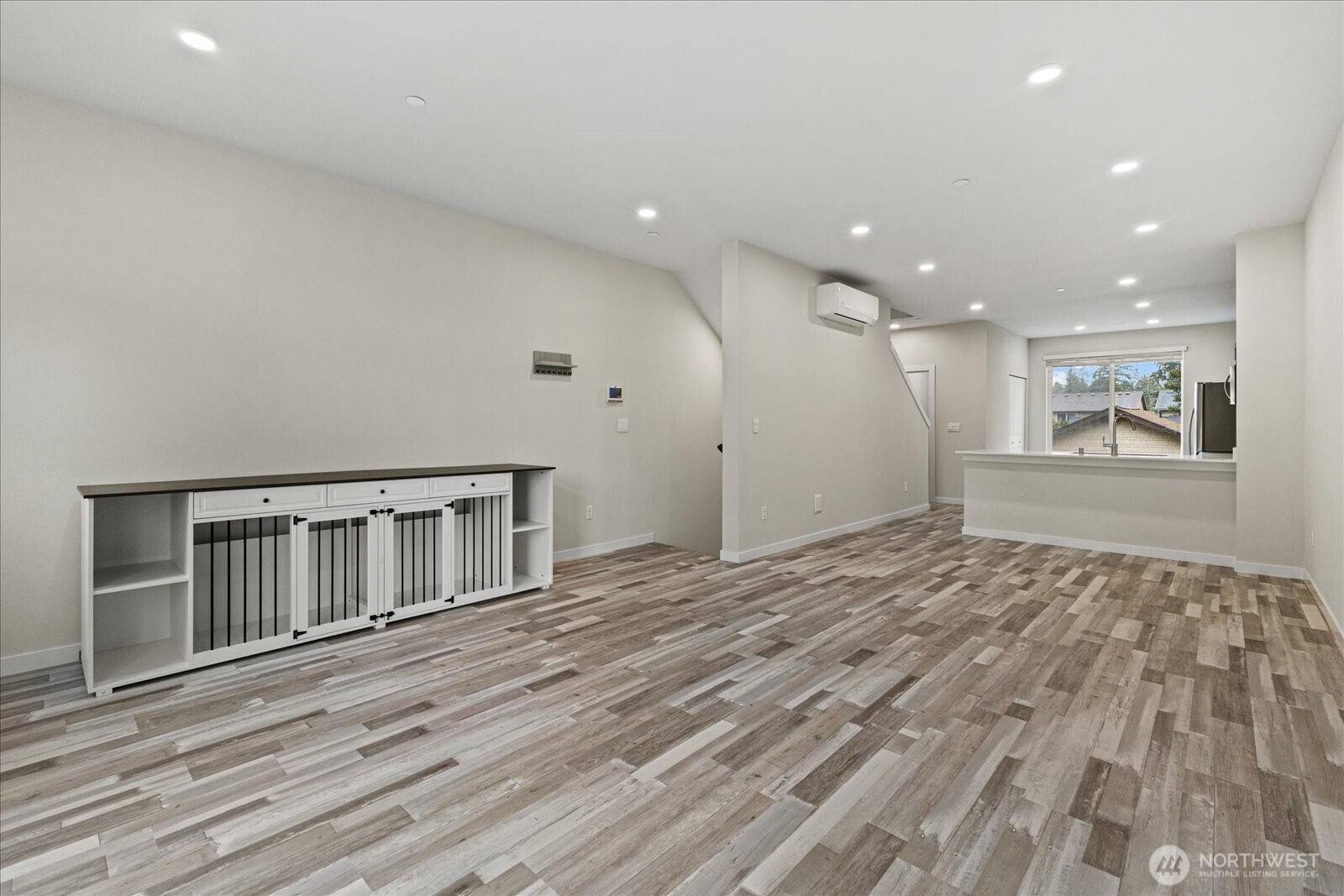 1831 100th Street Southwest, Unit B Everett, WA 98204 - Photo 12 of 27 a view of an empty room with wooden floor and a window