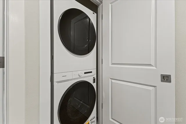 a close view of a utility room with dryer and washer