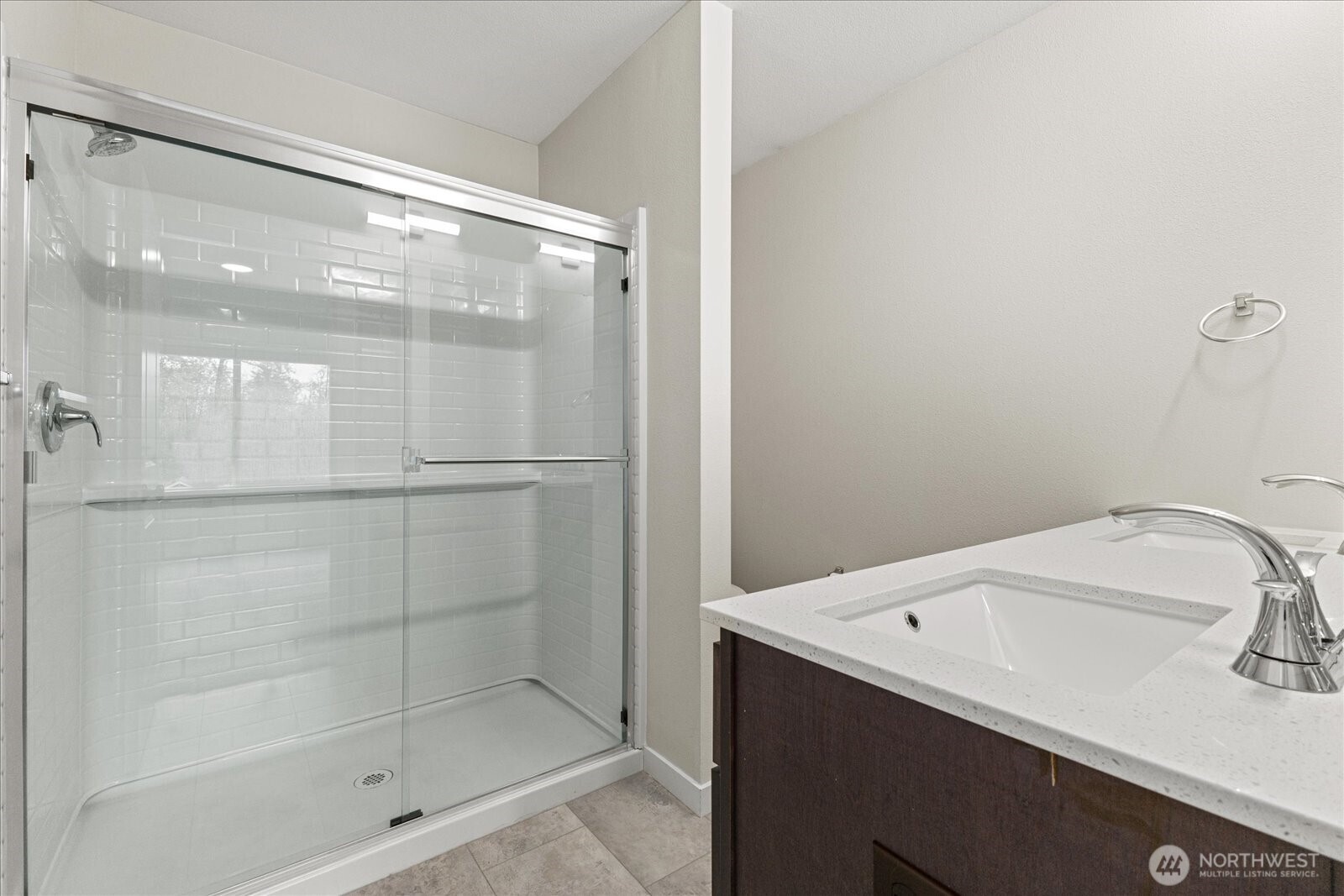 1831 100th Street Southwest, Unit B Everett, WA 98204 - Photo 21 of 27 a bathroom with a sink and shower