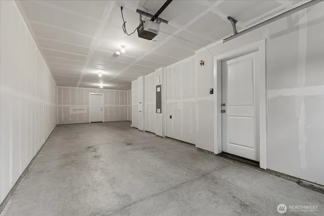 a view of empty room with ceiling fan