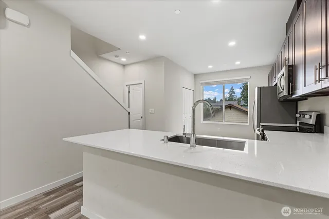 a bathroom with a sink and a large mirror