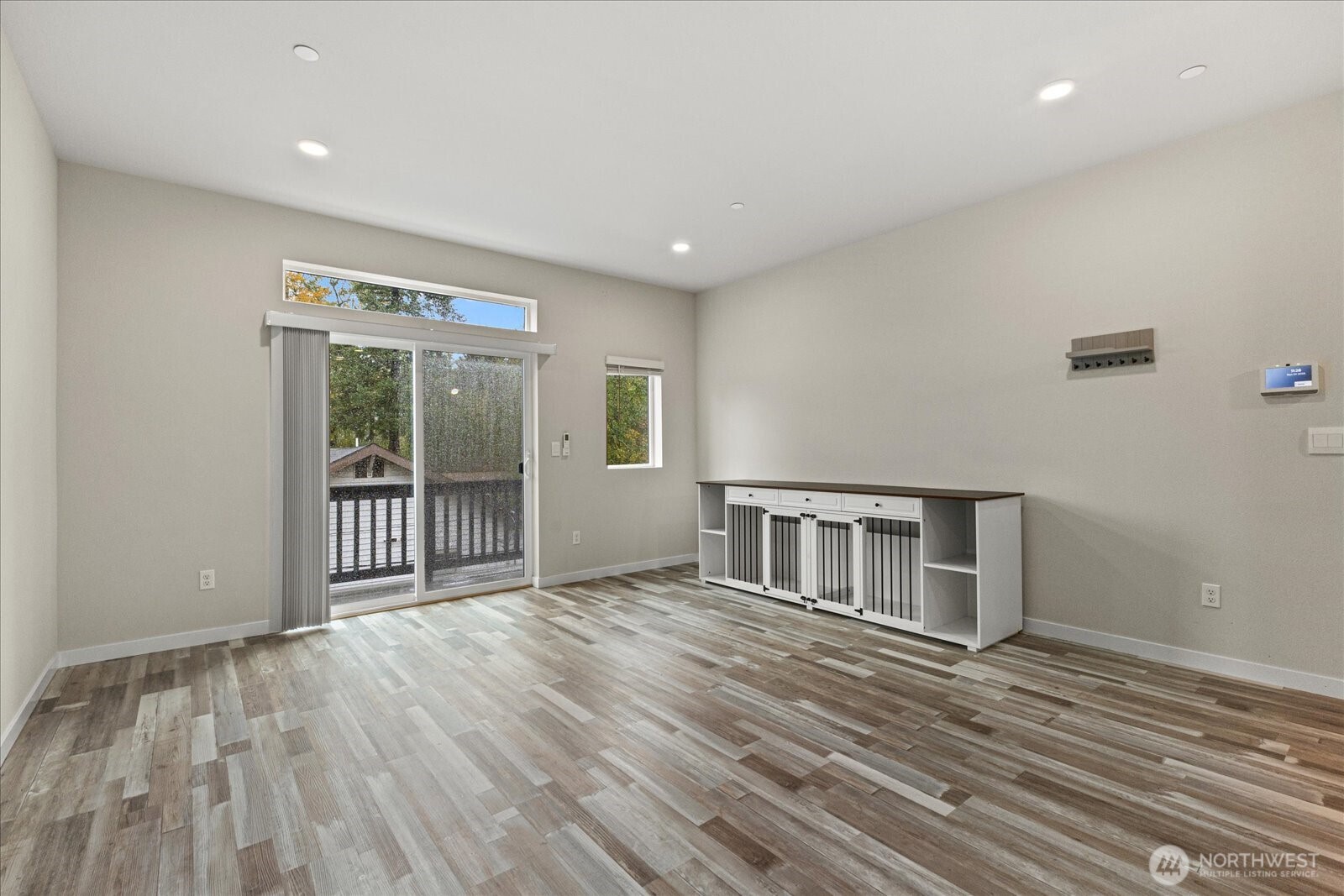 1831 100th Street Southwest, Unit B Everett, WA 98204 - Photo 10 of 27 a view of an empty room with wooden floor and a window