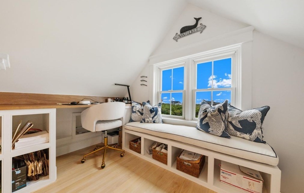 26 Old Tom Nevers Road, Unit 1 Nantucket, MA 02554 - Photo 19 of 31 a bedroom with furniture and a fireplace