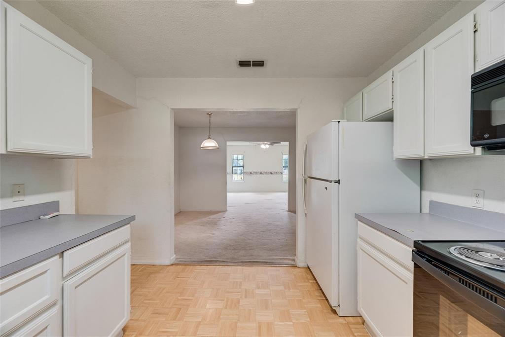 918 Prairie Avenue Cleburne, TX 76033 - Photo 22 of 25 a kitchen with stainless steel appliances granite countertop a refrigerator and a stove