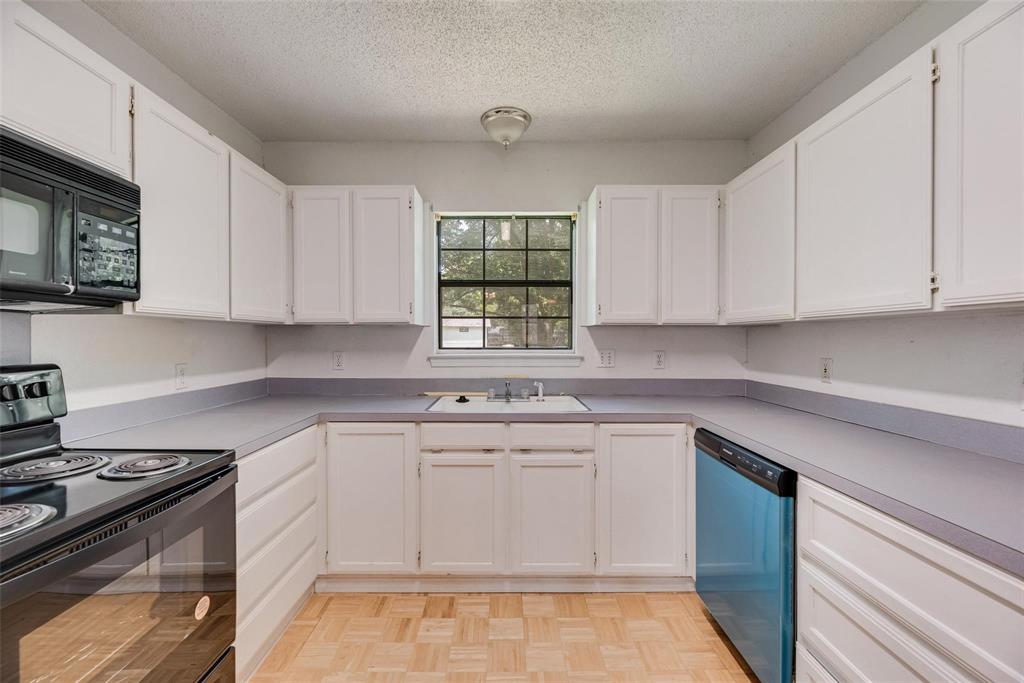 918 Prairie Avenue Cleburne, TX 76033 - Photo 3 of 25 a kitchen with a sink stove and cabinets