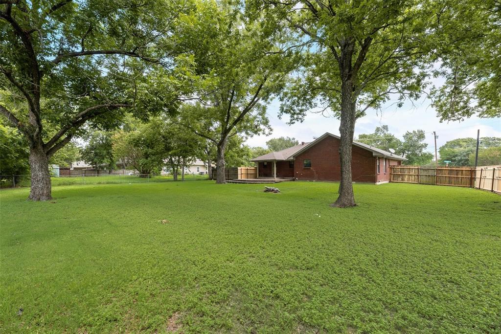 918 Prairie Avenue Cleburne, TX 76033 - Photo 5 of 25 a view of a house with a yard