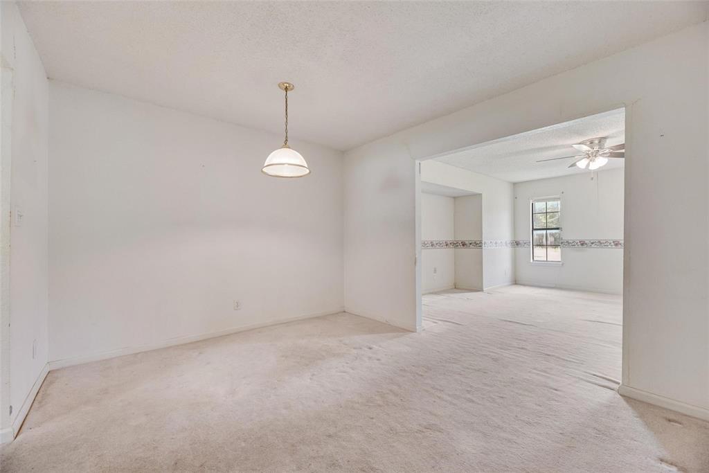 918 Prairie Avenue Cleburne, TX 76033 - Photo 10 of 25 a view of an empty room with a kitchen