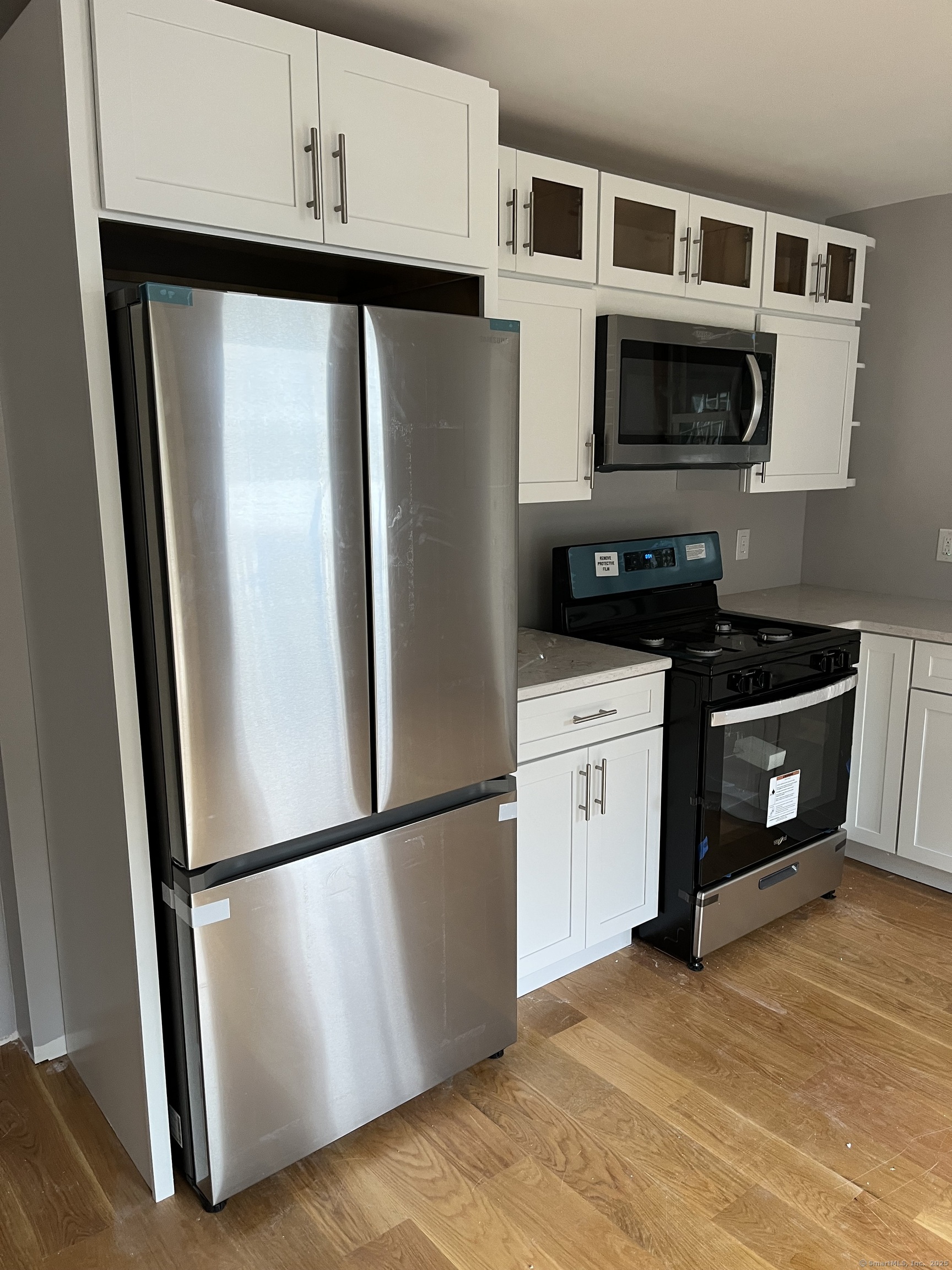 806 Quinnipiac Avenue New Haven, CT 06513 - Photo 4 of 6 a white refrigerator freezer and a stove sitting inside of a kitchen