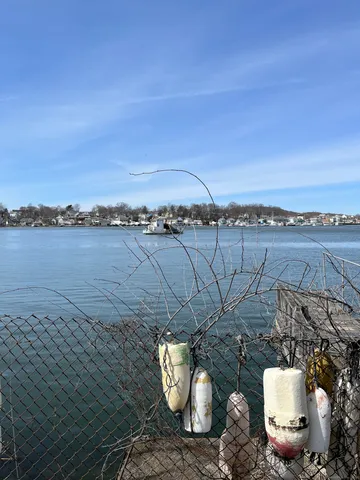 a view of a terrace with water view and mountain view