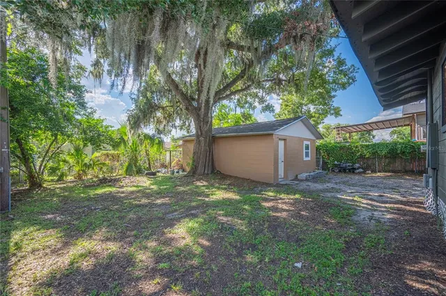 a backyard of a house with lots of green space