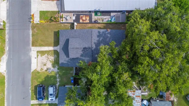 an aerial view of a residential apartment building with a yard