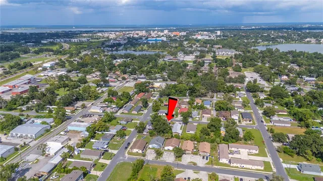 an aerial view of residential building and car parked