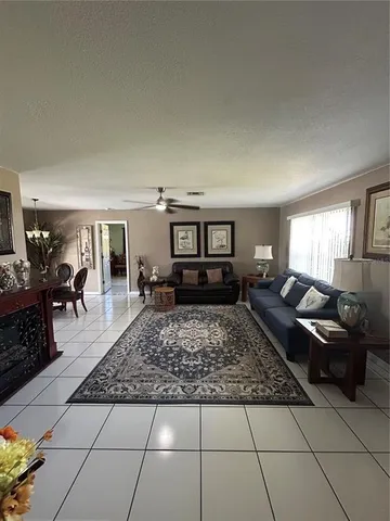 a living room with furniture rug and window