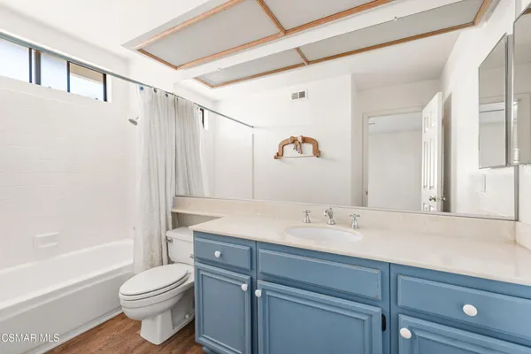 a bathroom with a sink a toilet and a bathtub