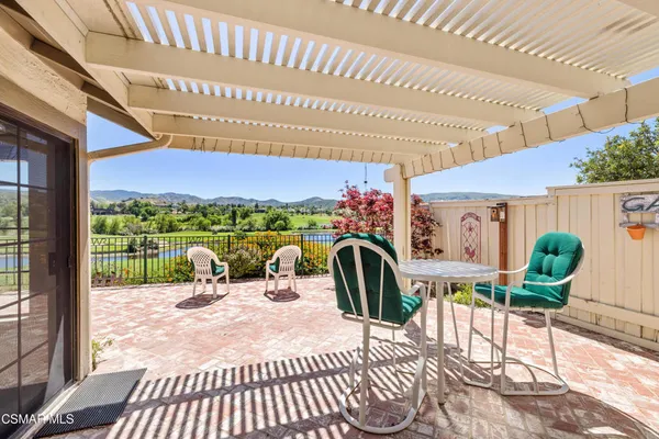 a view of a patio with a table chairs and a patio