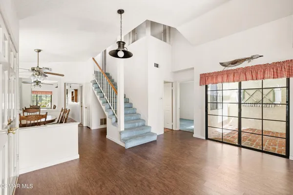 a view of an entryway with wooden floor