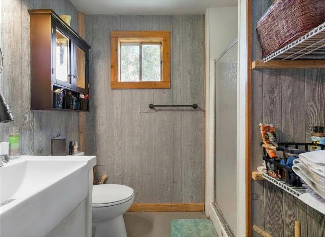 182 Smith Road Palacios, TX 77465 - Photo 13 of 23 a bathroom with a sink toilet and shower