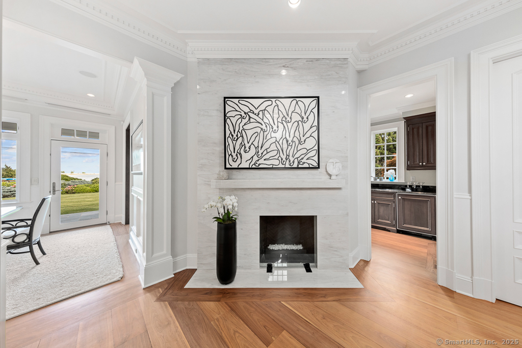 260 Hillspoint Road Westport, CT 06880 - Photo 12 of 40 a view of a hallway with furniture and a fireplace