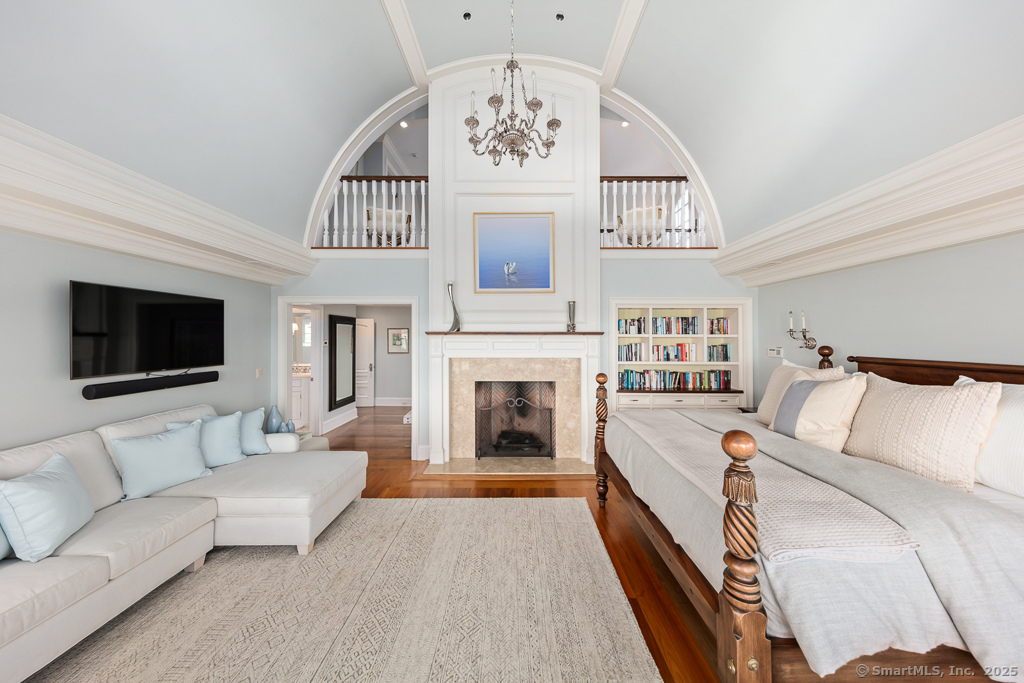 260 Hillspoint Road Westport, CT 06880 - Photo 17 of 40 a living room with furniture a flat screen tv and a fireplace